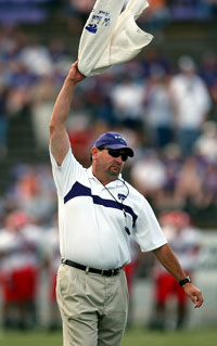 coach cole waving towel on sideline